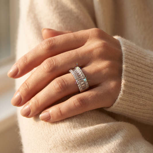 White Gold over Sterling Silver Women's Baguette Cut CZ Statement Ring worn on a woman's hand in warm window light