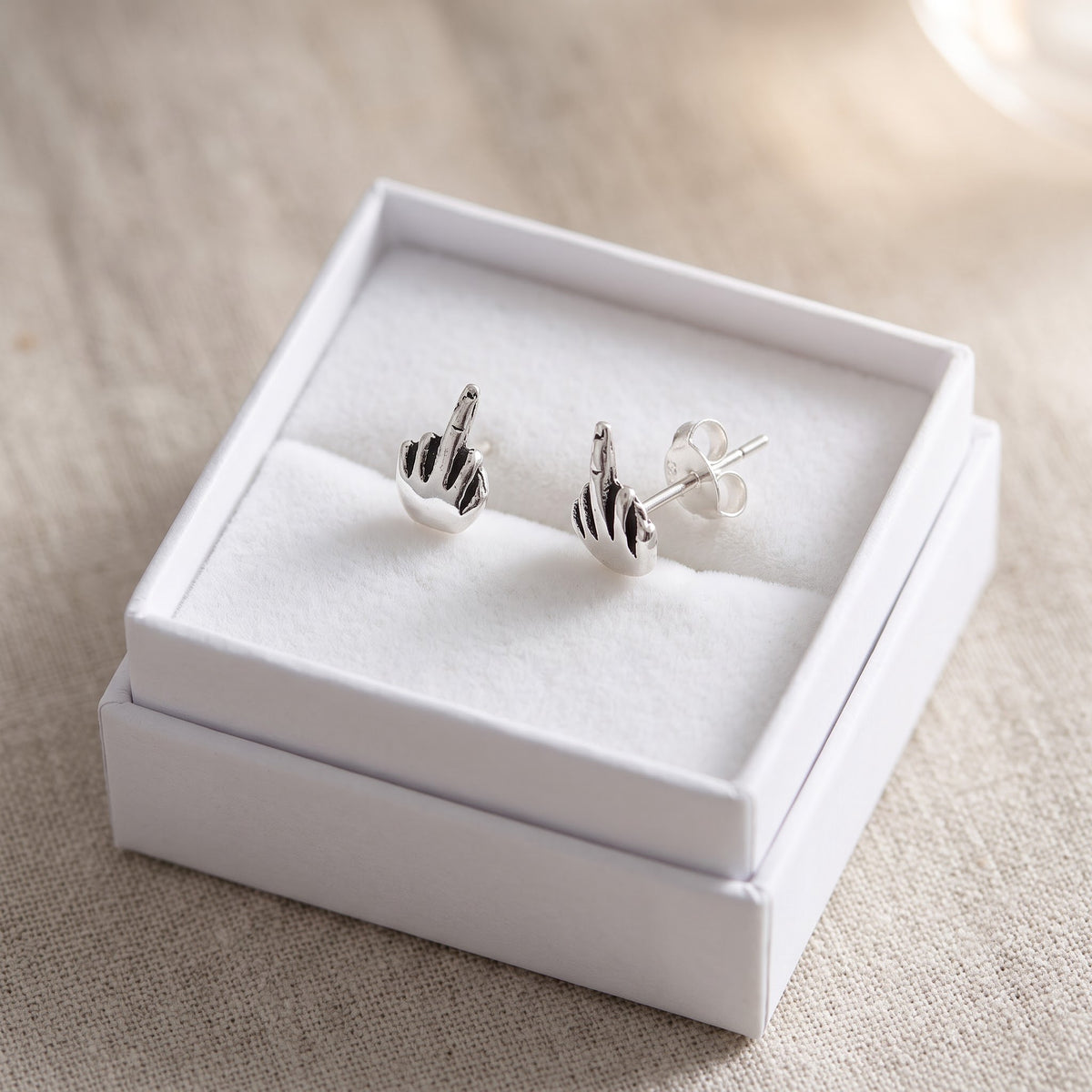 Sterling Silver Middle Finger Stud Earrings, 7mm in a white gift box, ready to give