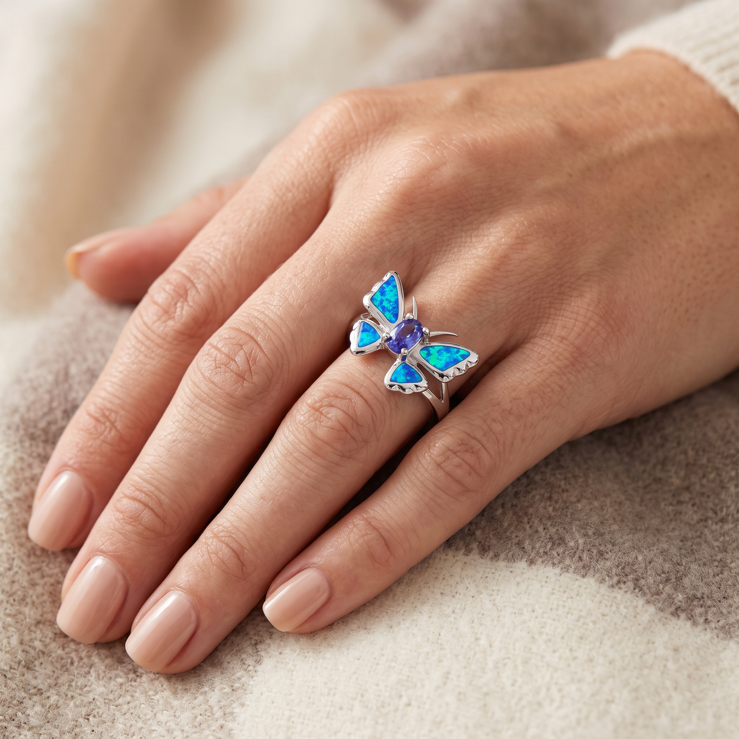 Sterling Silver Lab Opal Butterfly Tanzanite CZ Ring worn on hand