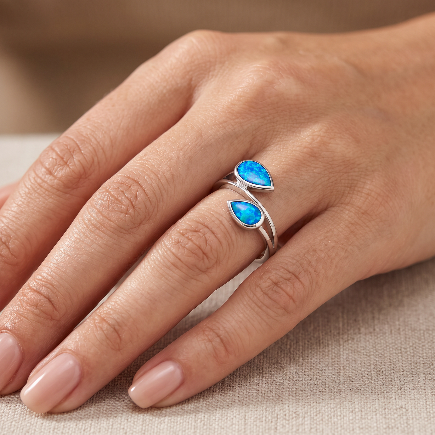 Sterling Silver Feather Blue Lab Opal Ring worn on hand