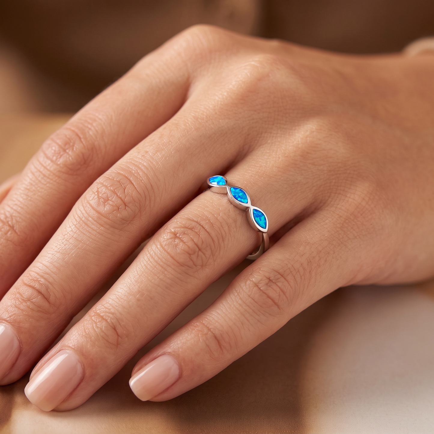 Sterling Silver Triple Marquise Blue Lab Opal Ring worn on hand