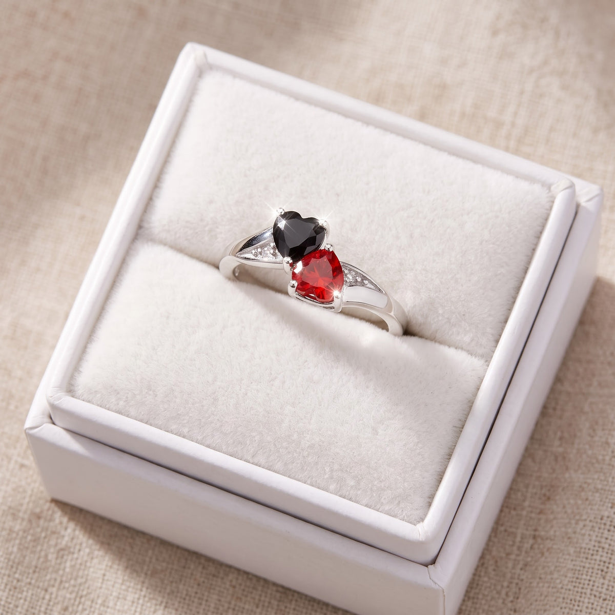 Sterling Silver Black & Red CZ Double Heart Ring in a white gift box, ready to give