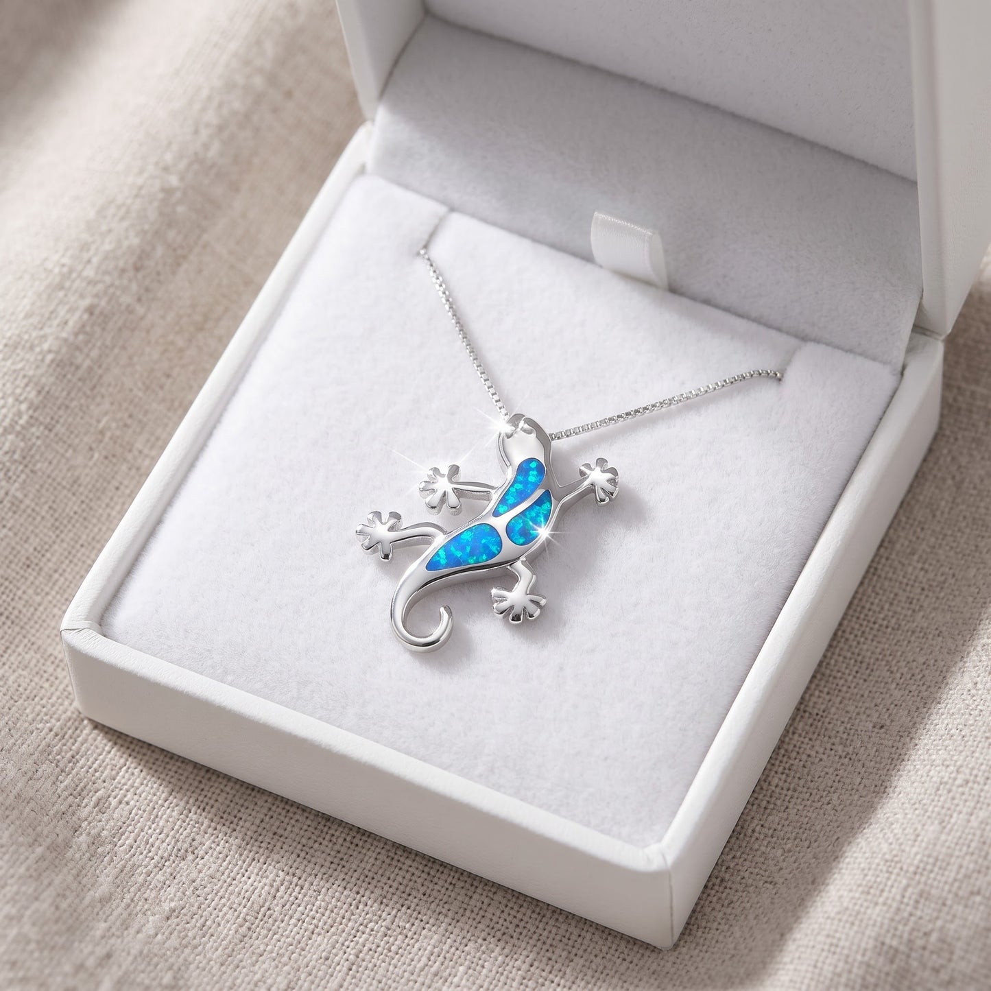 Sterling Silver Blue Created Opal Gecko Necklace - 30mm in a white gift box, ready to give