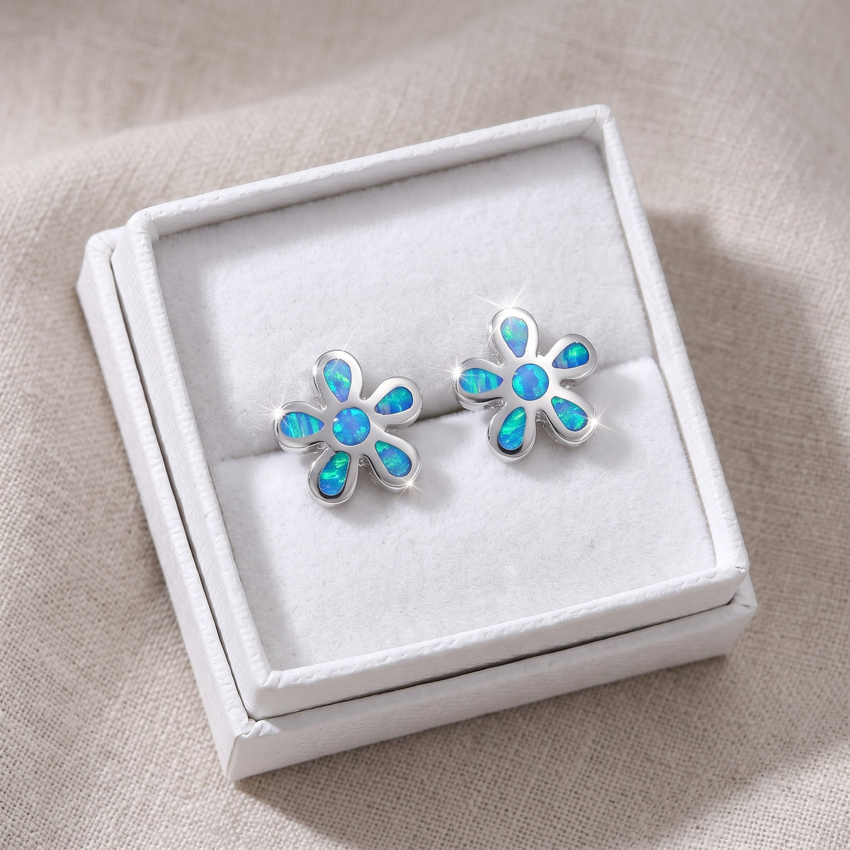 Sterling Silver Girls Blue Lab Opal Plumeria Flower Stud Earrings, 10mm in a white gift box, ready to give