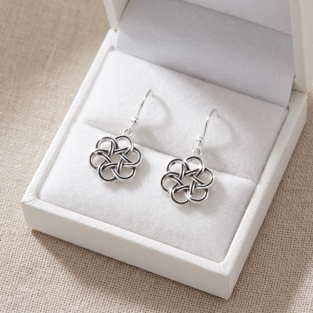 Sterling Silver Celtic Flower Dangle Earrings in a white gift box, ready to give
