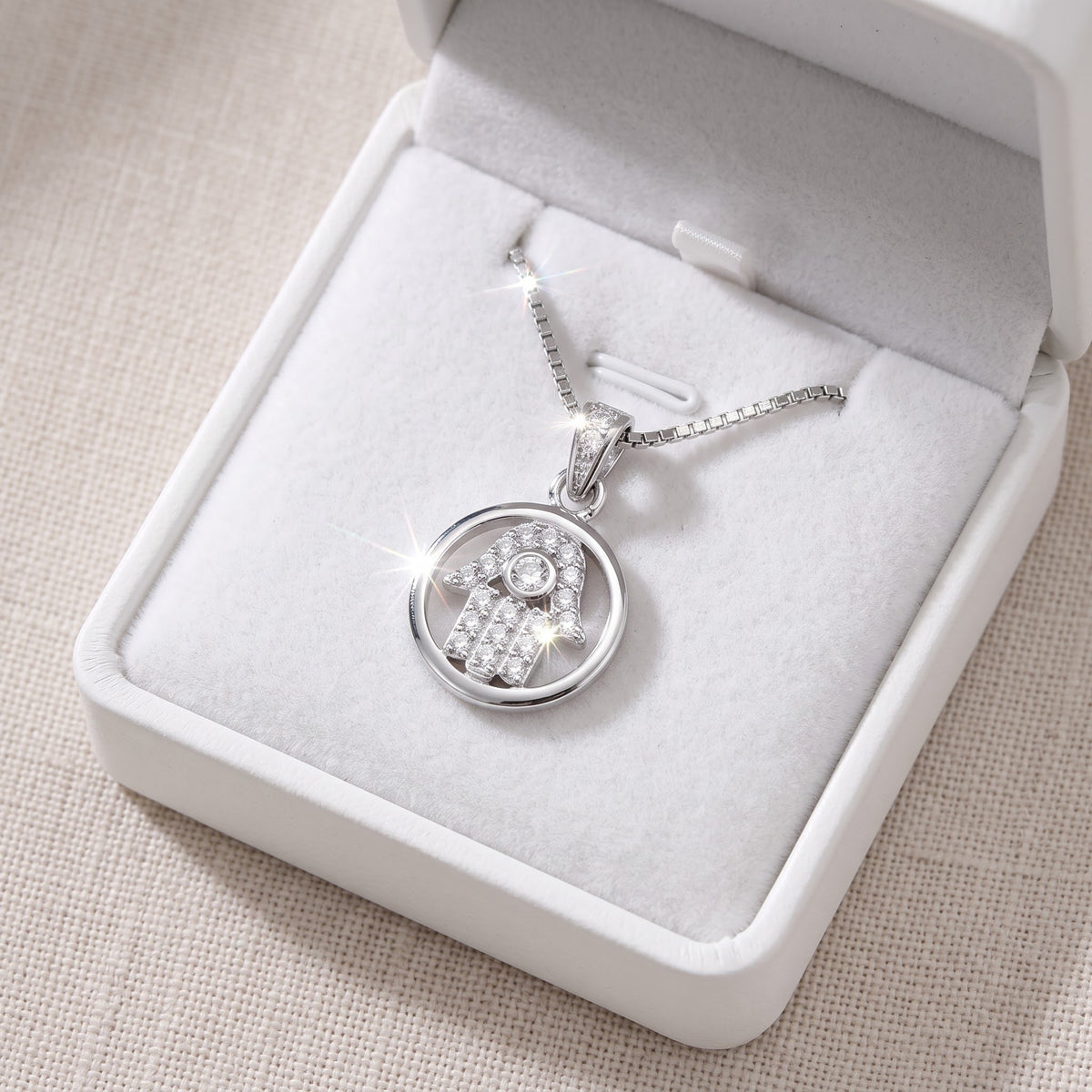 Sterling Silver CZ Hamsa Hand Necklace in a white gift box, ready to give