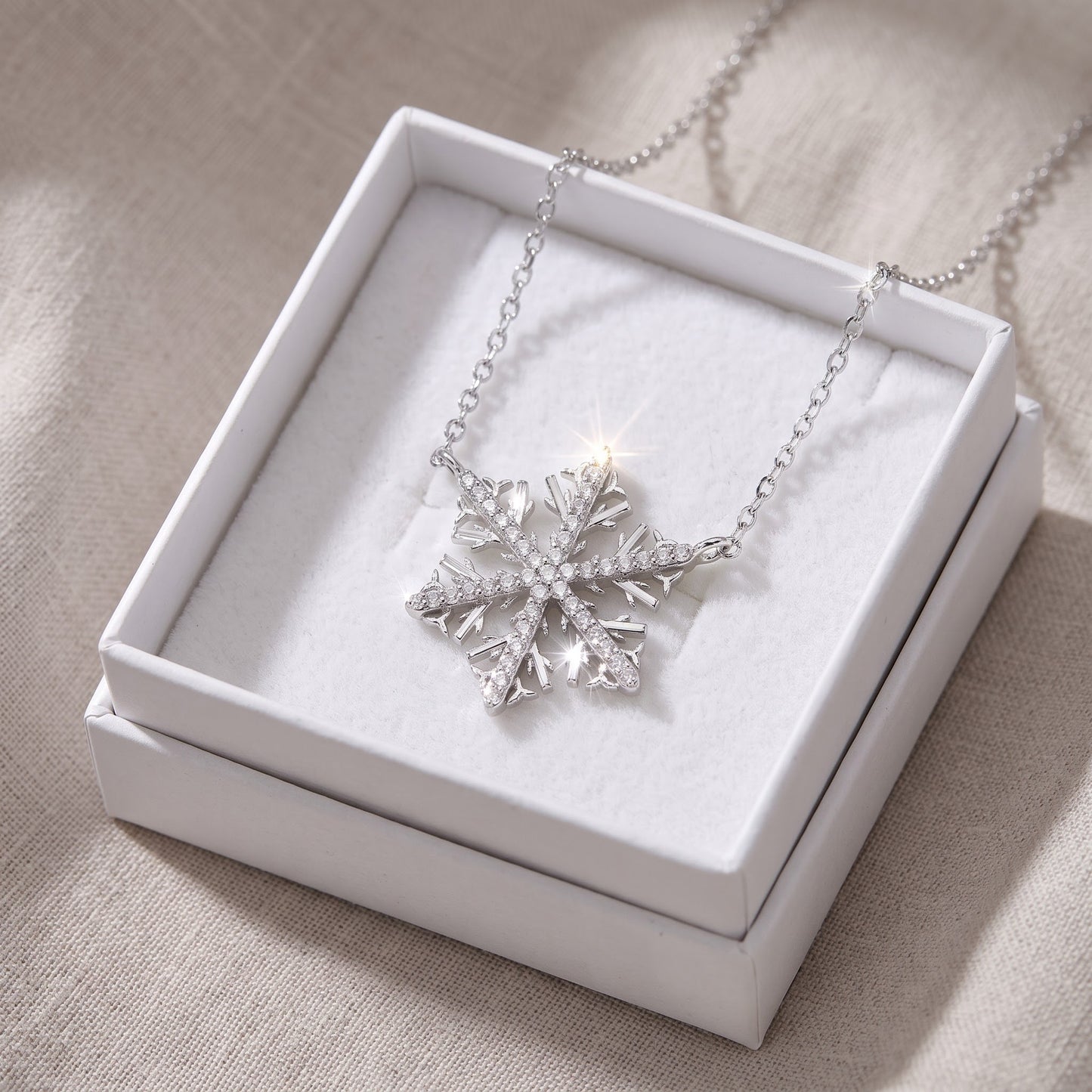 Sterling Silver CZ Snowflake Necklace in a white gift box, ready to give