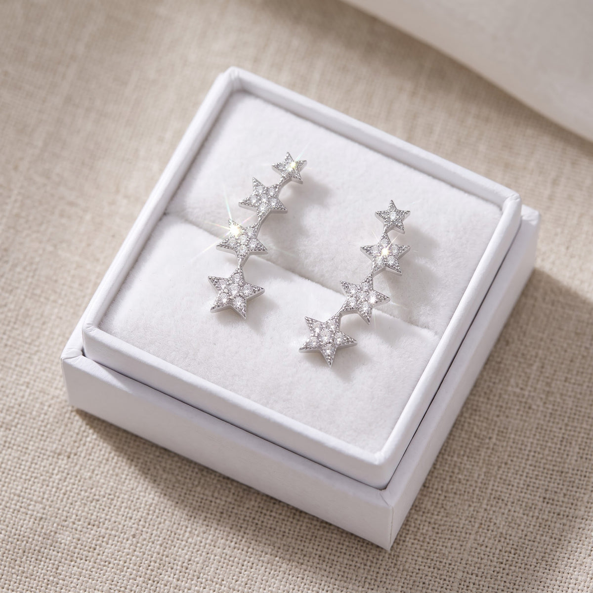 Sterling Silver CZ Star Ear Crawler Stud Earrings in a white gift box, ready to give