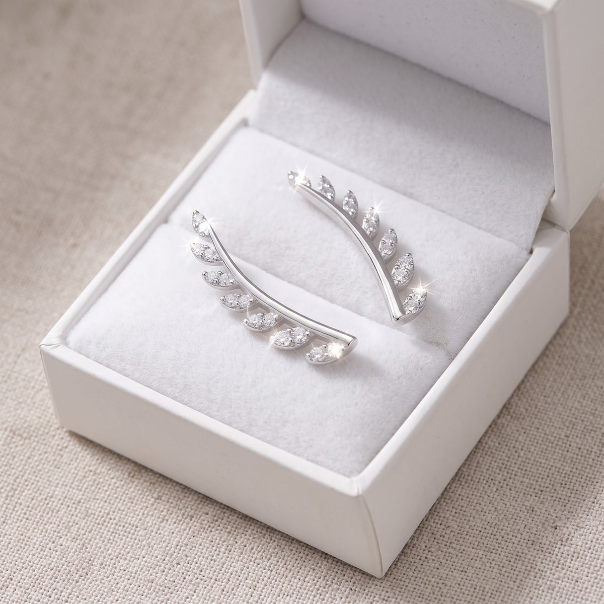 Sterling Silver CZ Vine Ear Crawler Stud Earrings in a white gift box, ready to give