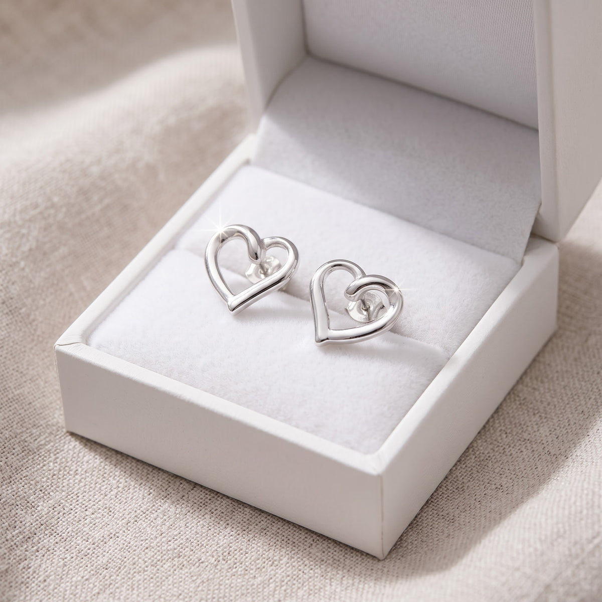 Sterling Silver Ladies Dainty Hollow Heart Stud Earrings, 8mm in a white gift box, ready to give