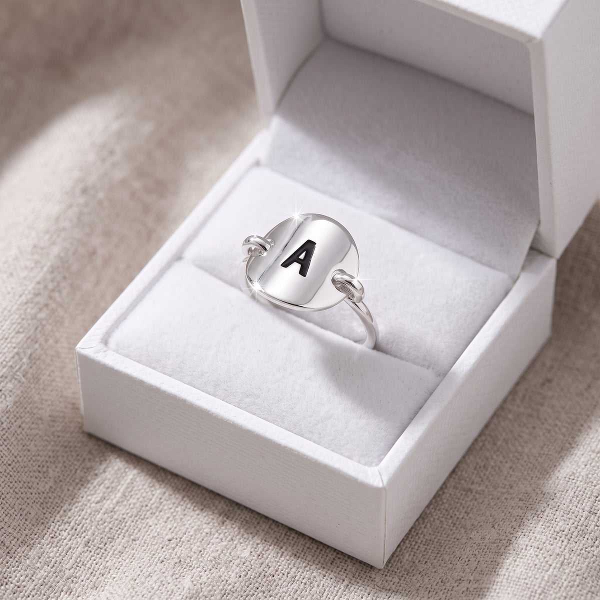 Sterling Silver Oval Initial A Ring in a white gift box, ready to give