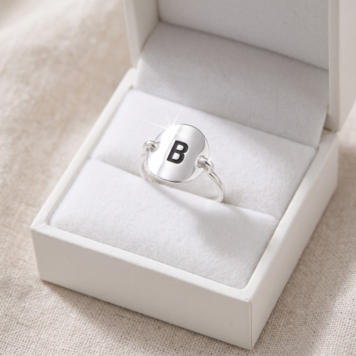 Sterling Silver Oval Initial B Ring in a white gift box, ready to give