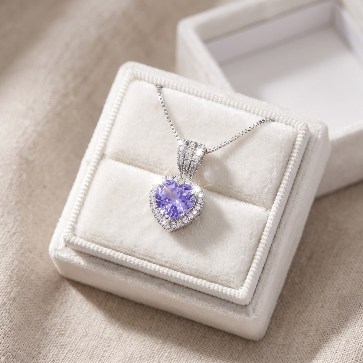 Sterling Silver Purple CZ Halo Heart Necklace in a white gift box, ready to give