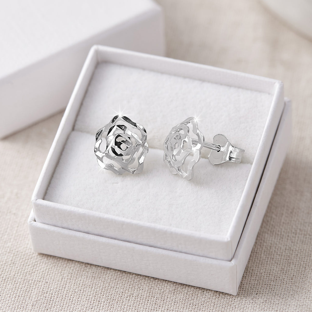 Sterling Silver Rose Flower Stud Earrings in a white gift box, ready to give