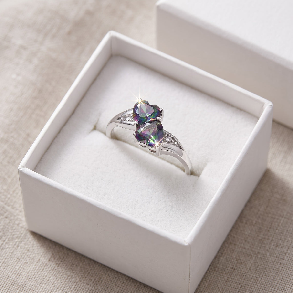 Sterling Silver Simulated Rainbow Topaz Double Heart Ring in a white gift box, ready to give