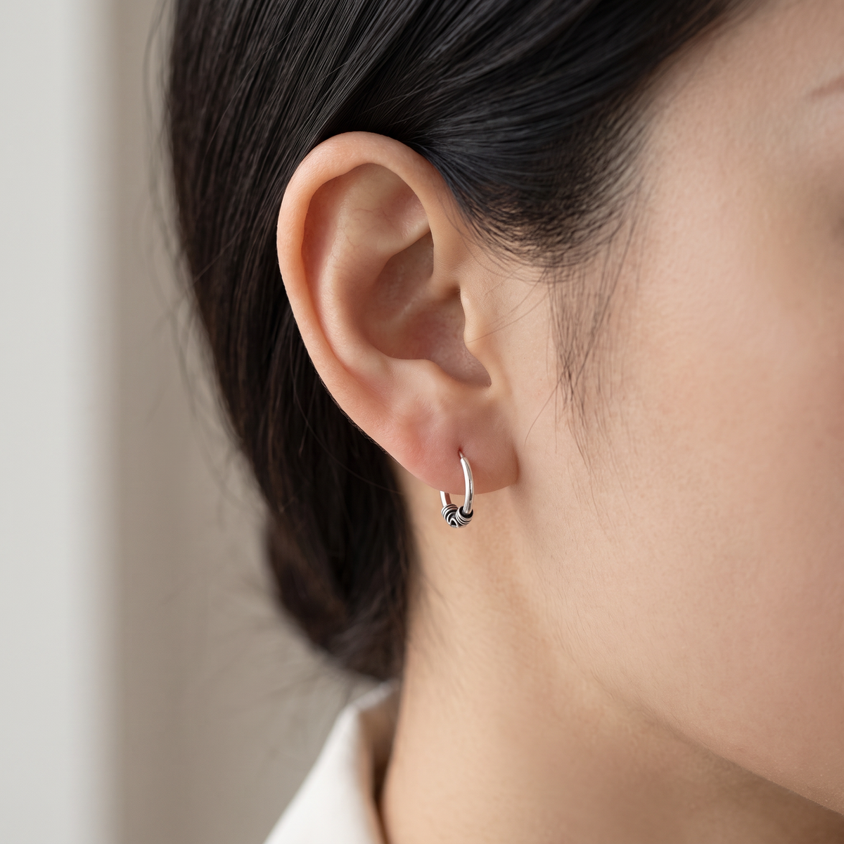 Sterling Silver Ladies Dainty Bali Hoop Earrings worn, lifestyle photo