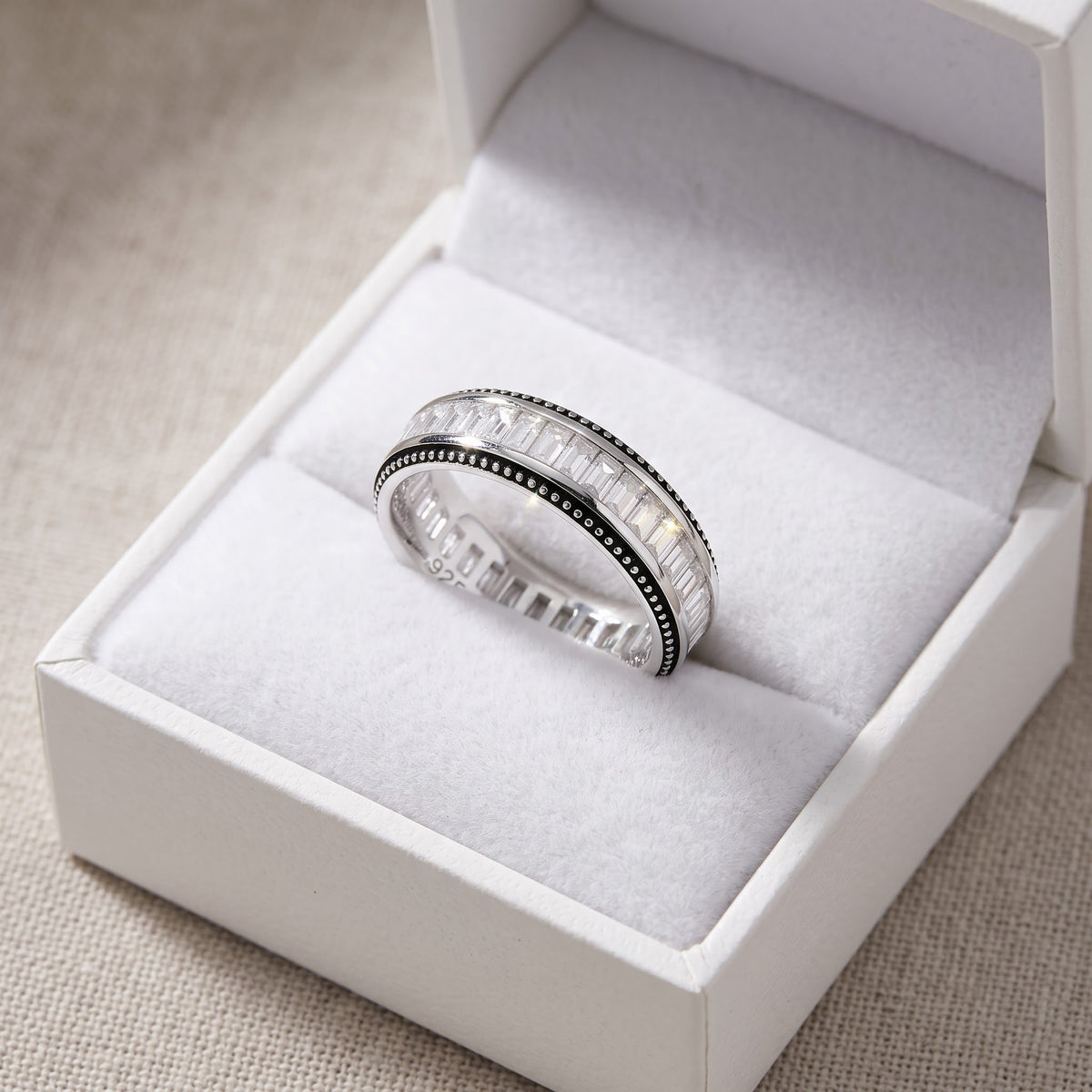 Sterling Silver Thing Baguette Cut CZ Eternity Ring in a white gift box, ready to give
