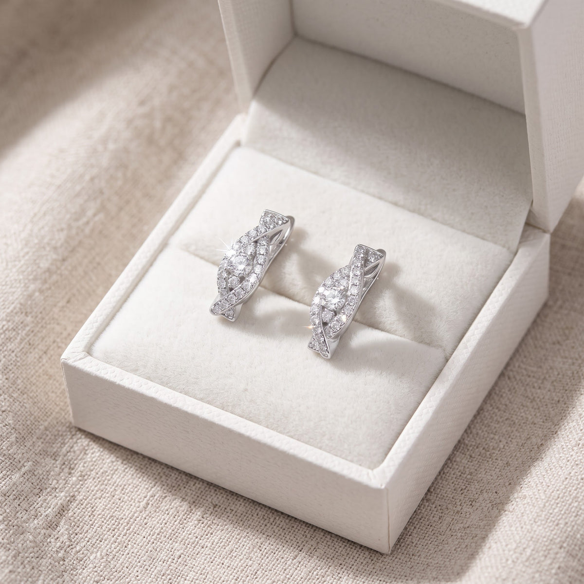 White Gold over Sterling Silver Women's Small CZ Huggie Earrings in a white gift box, ready to give