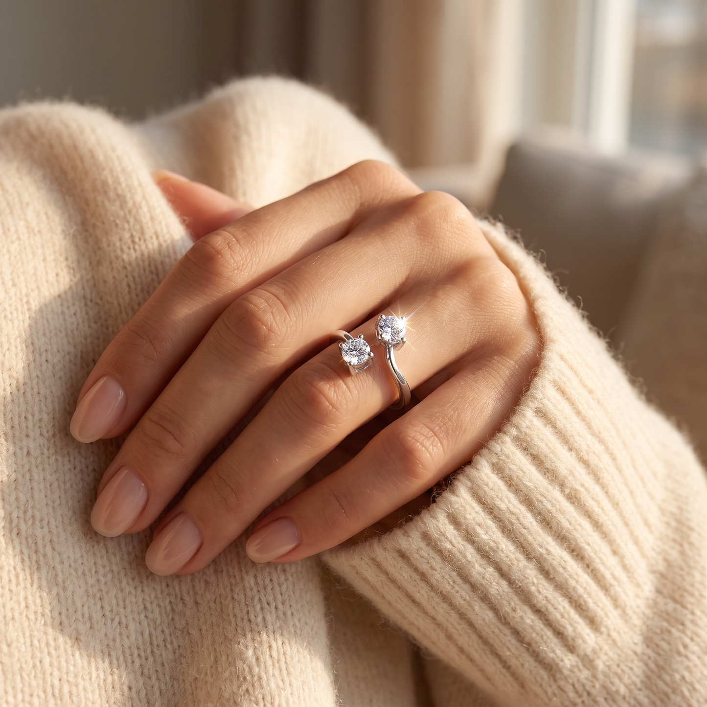 Sterling Silver Dual Round Cut Clear CZ Ring worn on a woman's hand in warm window light