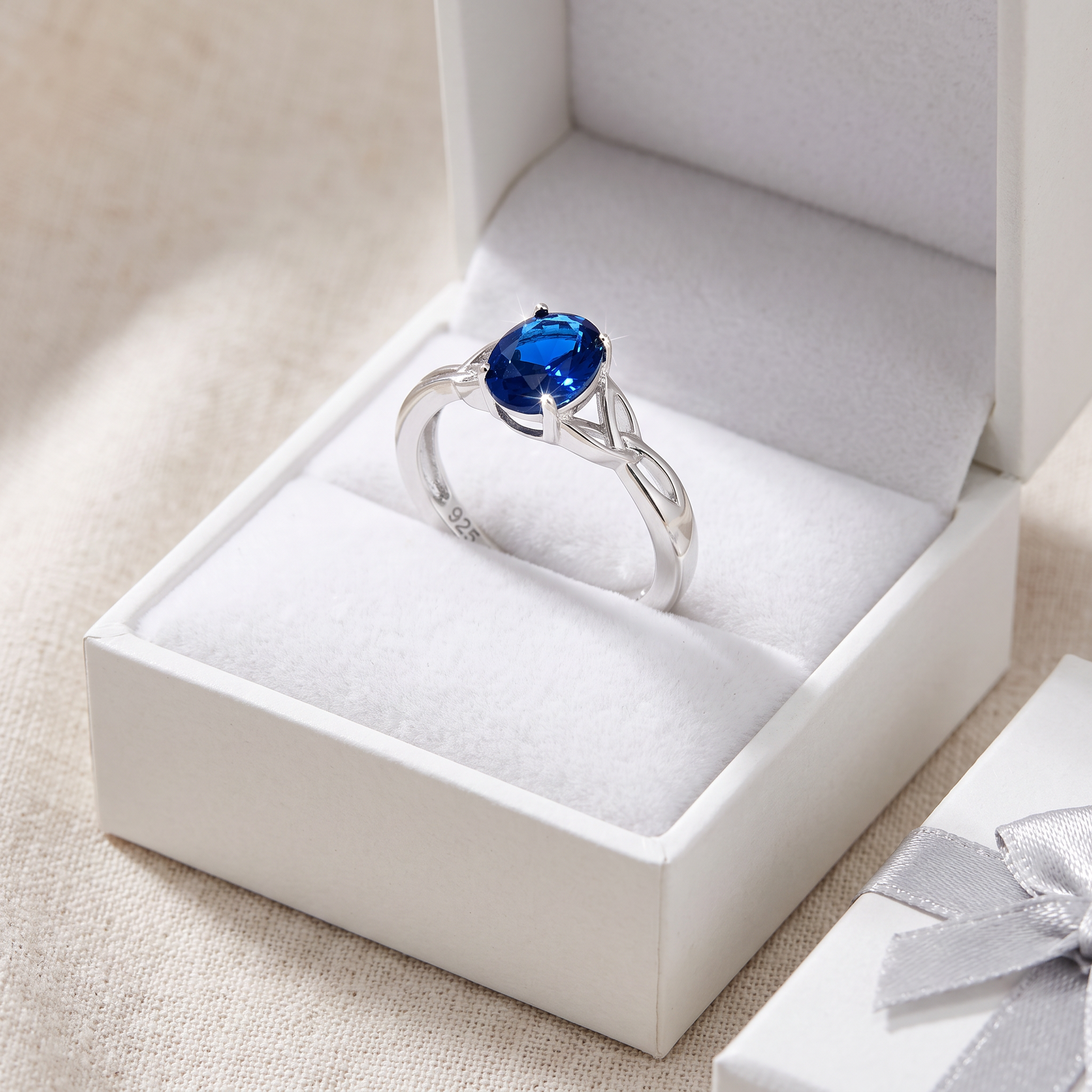 Sterling Silver Charmed Oval Blue CZ Ring in a white gift box, charmed oval blue cz gift for her
