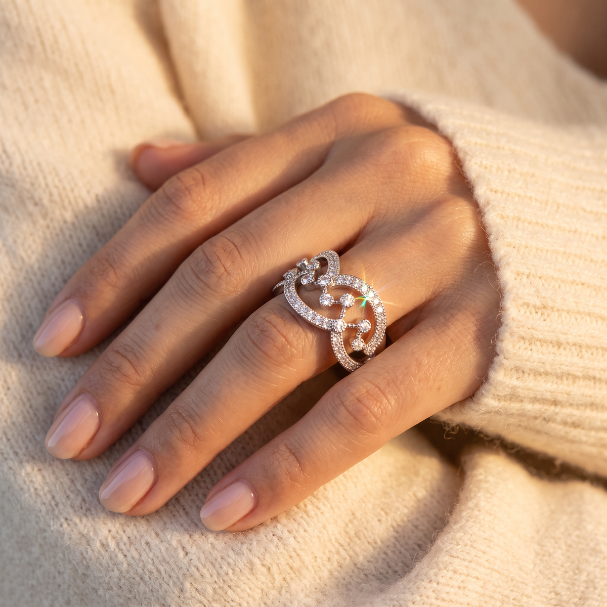 Sterling Silver CZ Free Form Chandelier Statement Ring worn on a woman's hand in warm window light