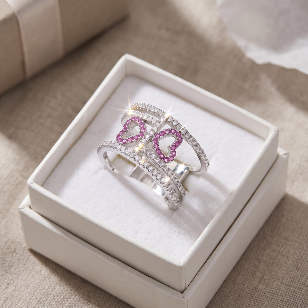 Sterling Silver CZ Double Heart Statement Ring in a white gift box, ready to give