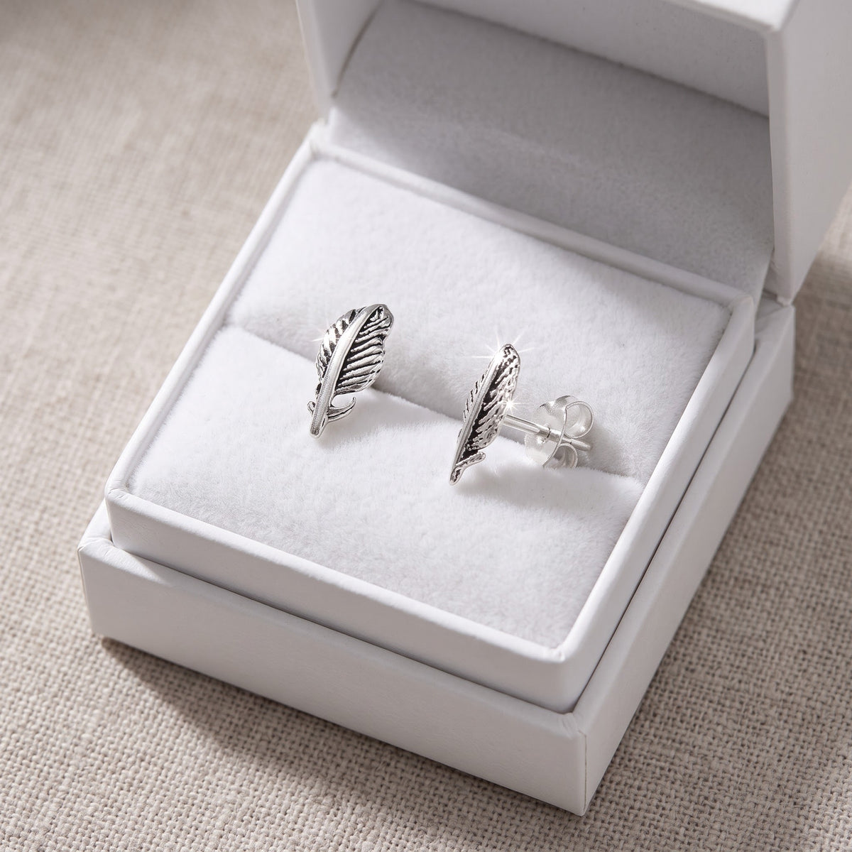 Sterling Silver Feather Stud Earrings, 8mm in a white gift box, ready to give