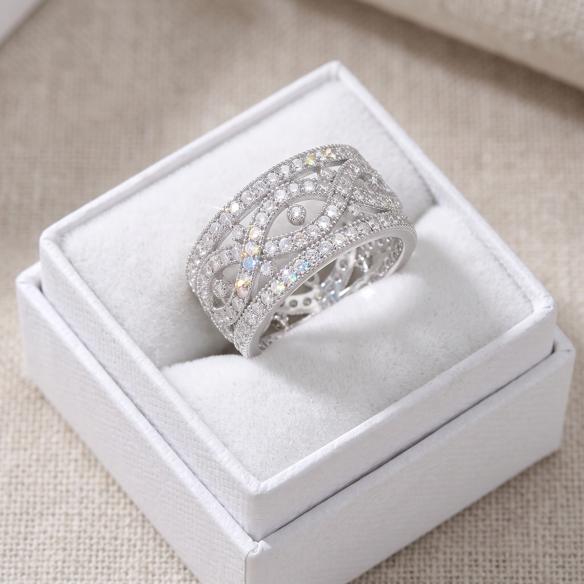 Sterling Silver Simulated Diamond Wide Infinity Statement Ring in a white gift box, ready to give