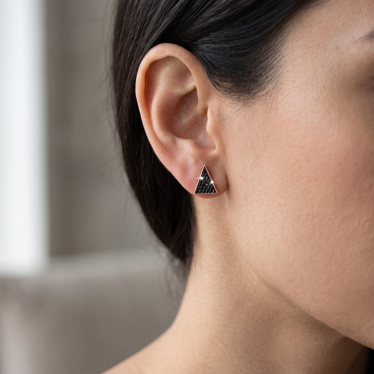 Rose Gold over Sterling Silver Women's Black CZ Triangle Stud Earrings worn, lifestyle photo