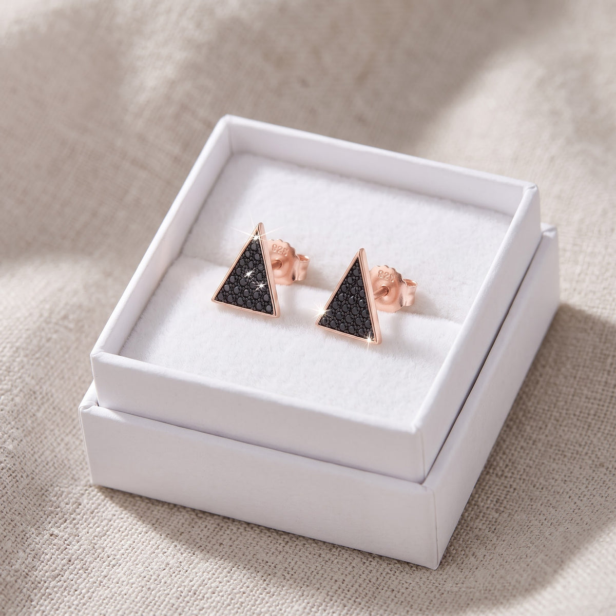 Rose Gold over Sterling Silver Women's Black CZ Triangle Stud Earrings in a white gift box, ready to give