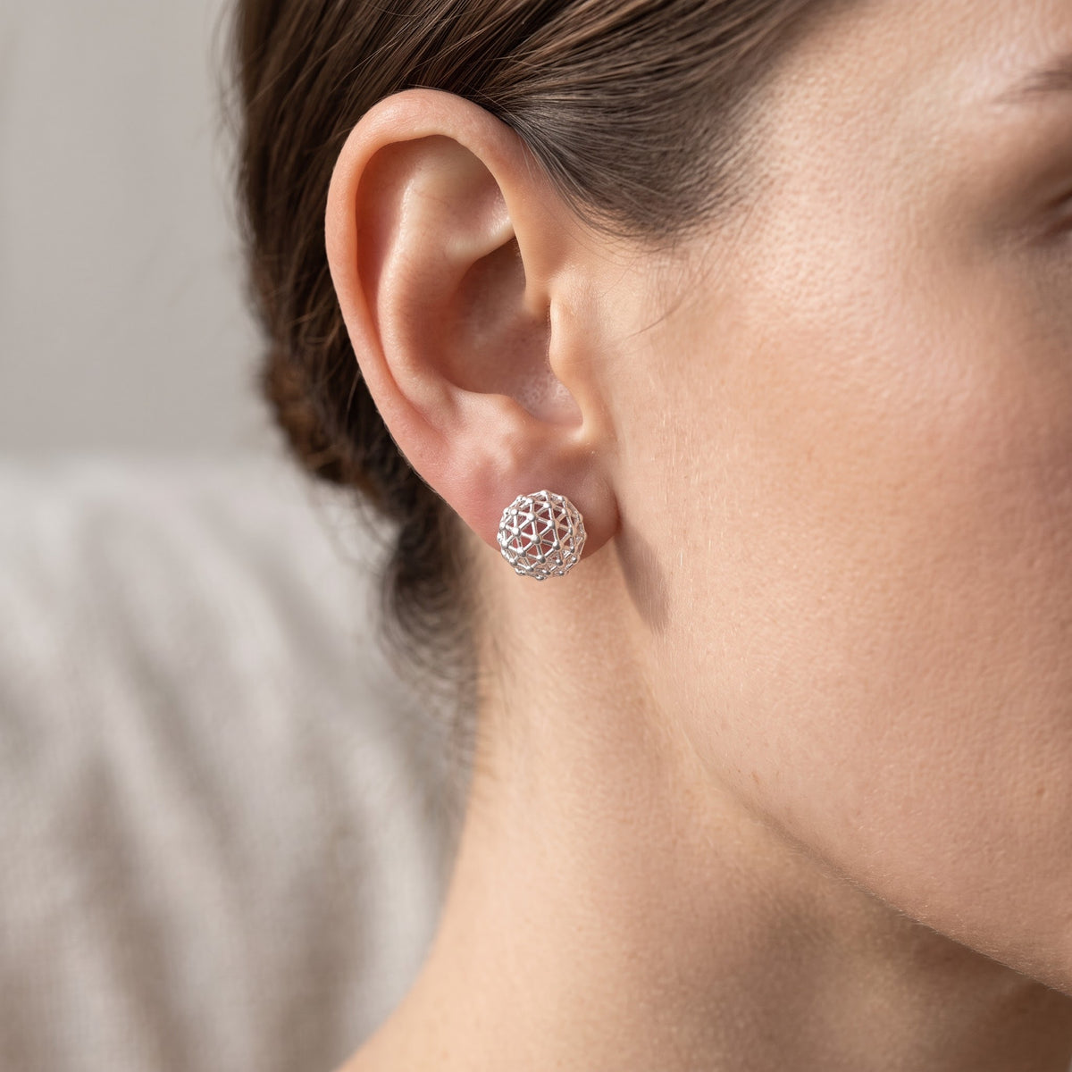 Sterling Silver Pentakis Dodecahedron Geometric Shape Stud Earrings for Women worn, lifestyle photo