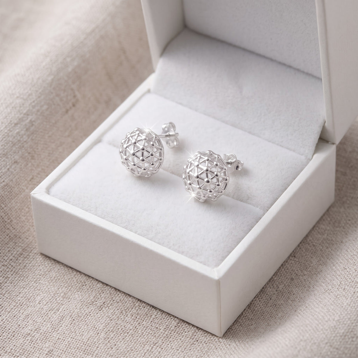 Sterling Silver Pentakis Dodecahedron Geometric Shape Stud Earrings for Women in a white gift box, ready to give