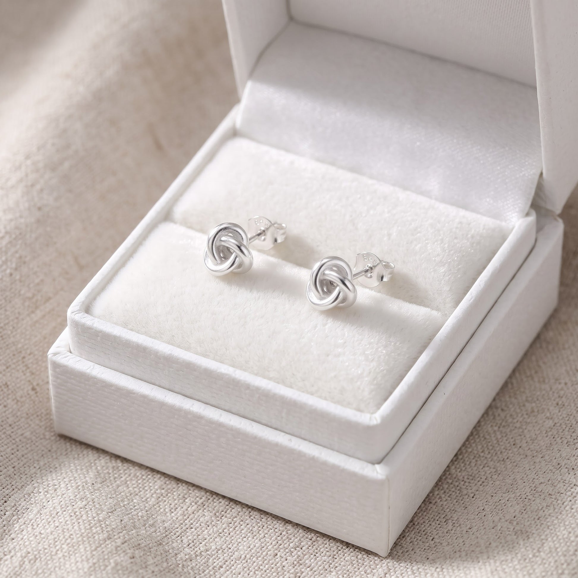 Sterling Silver Small Love Knot Women's stud Earrings Girls Love Knot Studs in a white gift box, ready to give