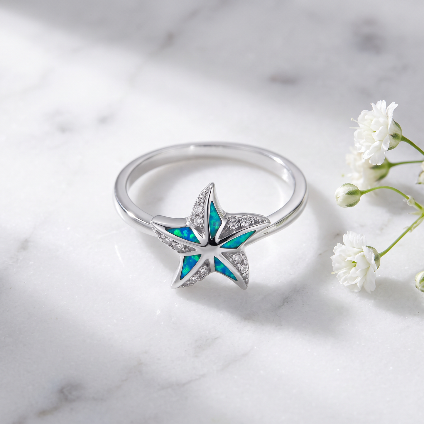 Sterling Silver Star Lab Opal CZ Ring on marble