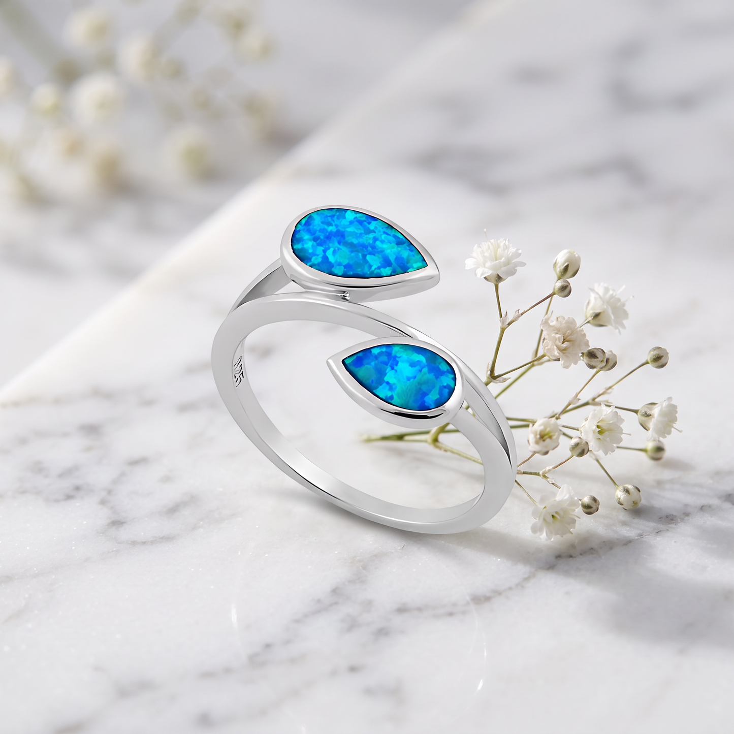 Sterling Silver Feather Blue Lab Opal Ring on marble