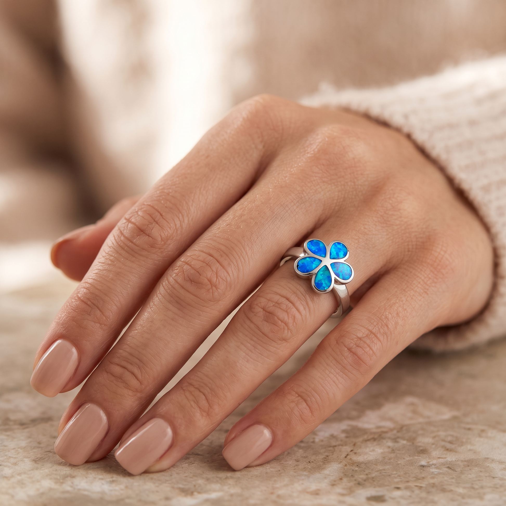 Sterling Silver Plumeria Lab Opal Ring worn on hand