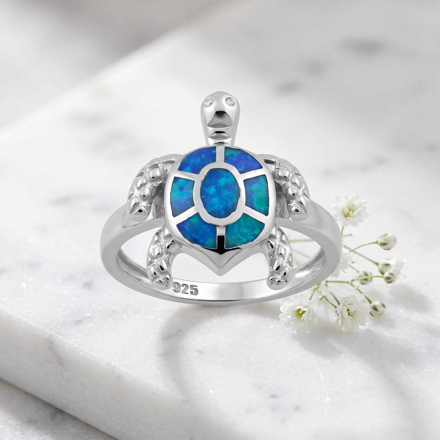 Sterling Silver Turtle Blue Lab Opal Ring on marble