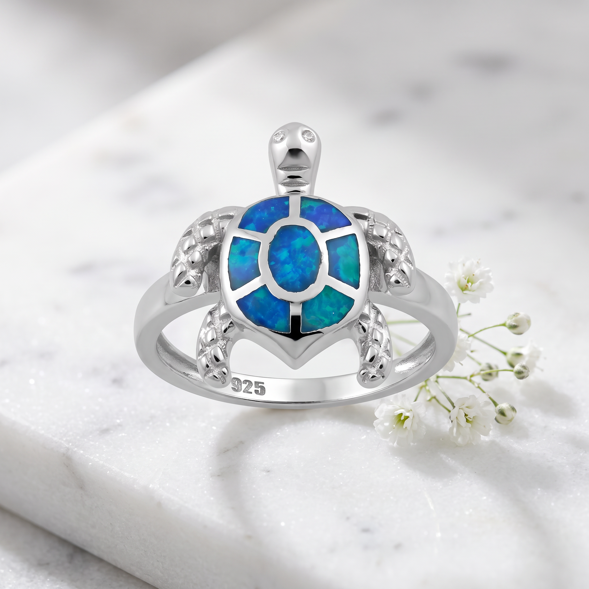 Sterling Silver Turtle Blue Lab Opal Ring on marble