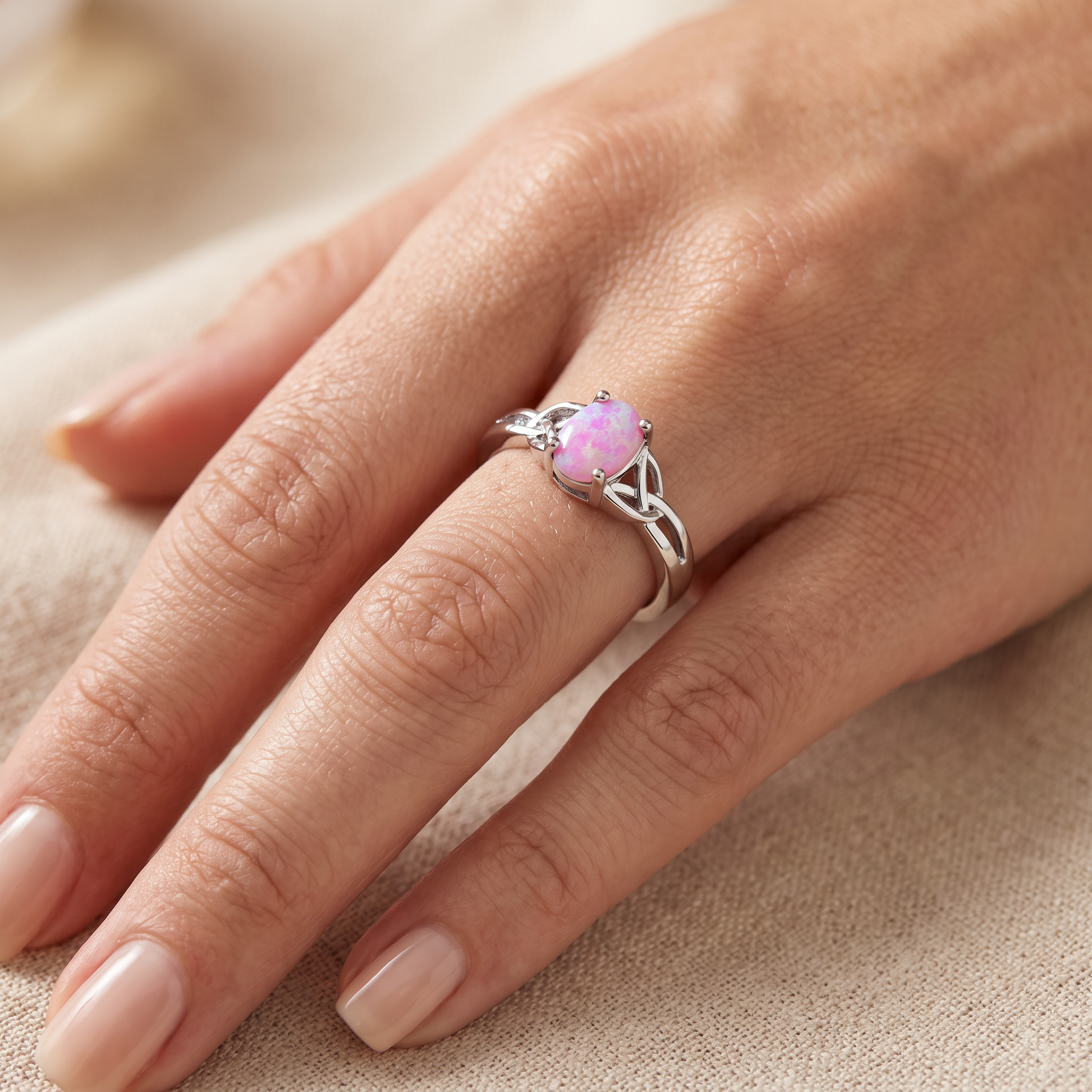 Sterling Silver Center Stone Charmed Pink Lab Opal Ring worn on hand