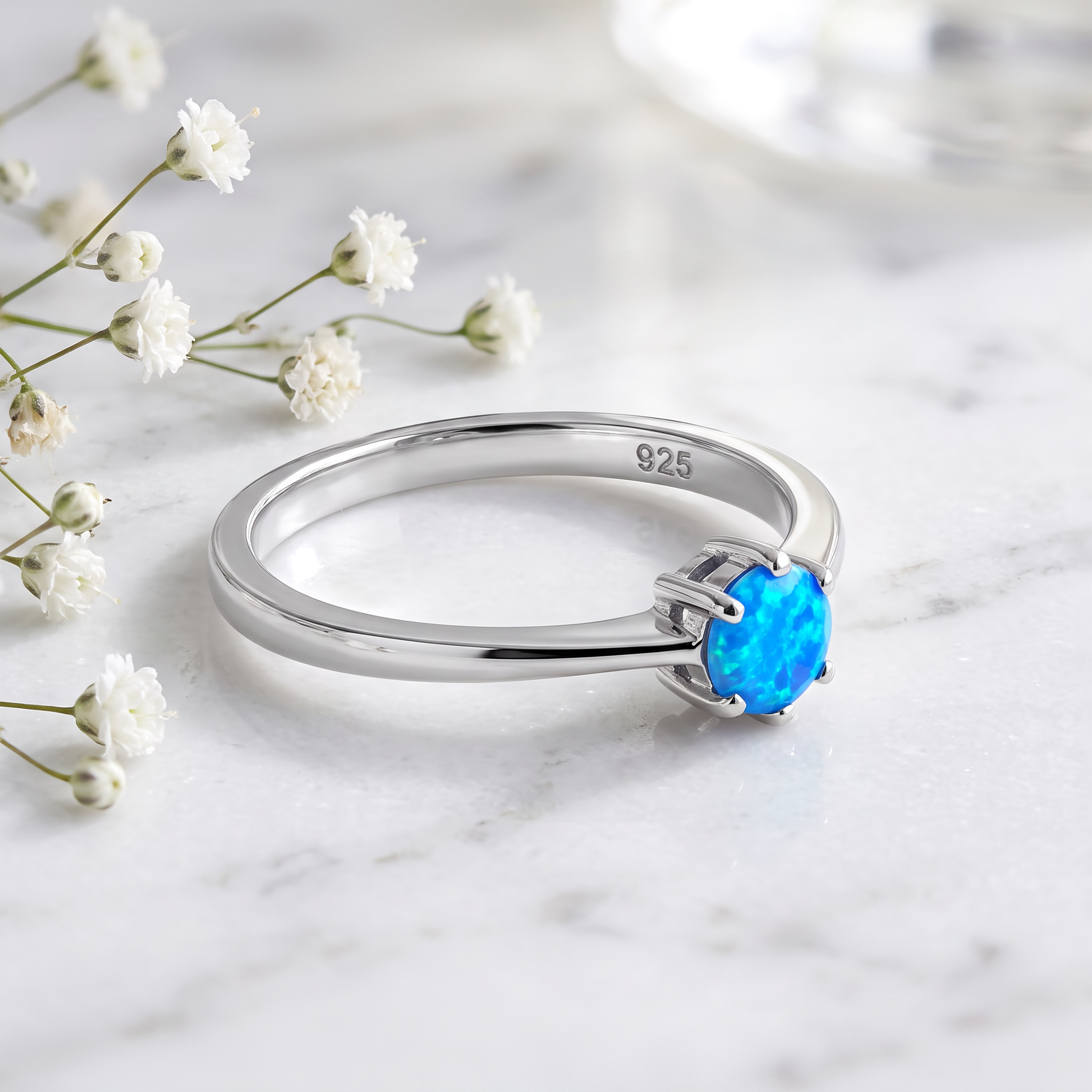 Sterling Silver Round Blue Lab Opal Ring on marble
