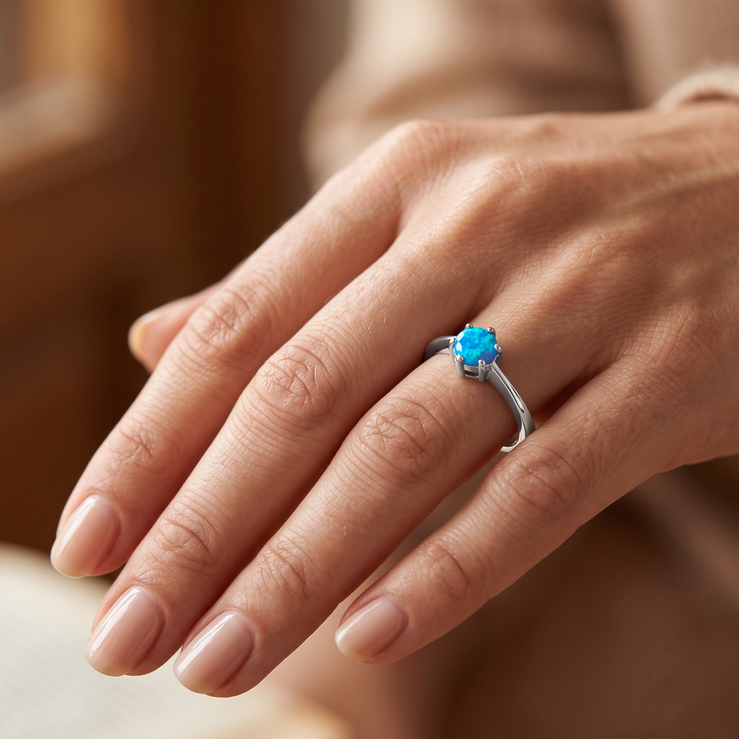 Sterling Silver Round Blue Lab Opal Ring worn on hand