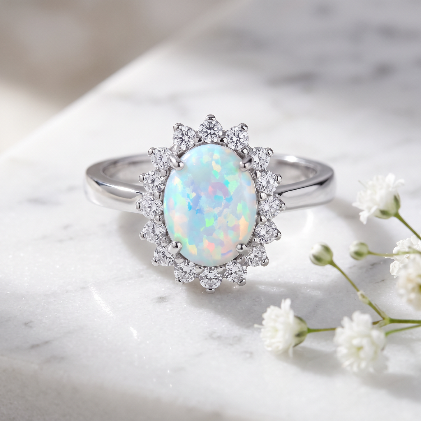 Sterling Silver Oval White Lab Opal CZ Ring on marble