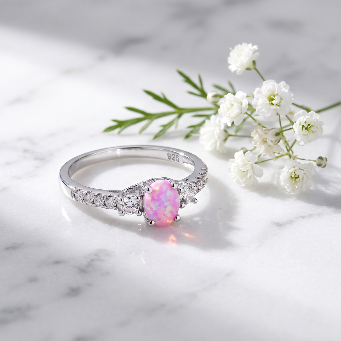 Sterling Silver Enchanted Oval Pink Lab Opal CZ Ring on marble
