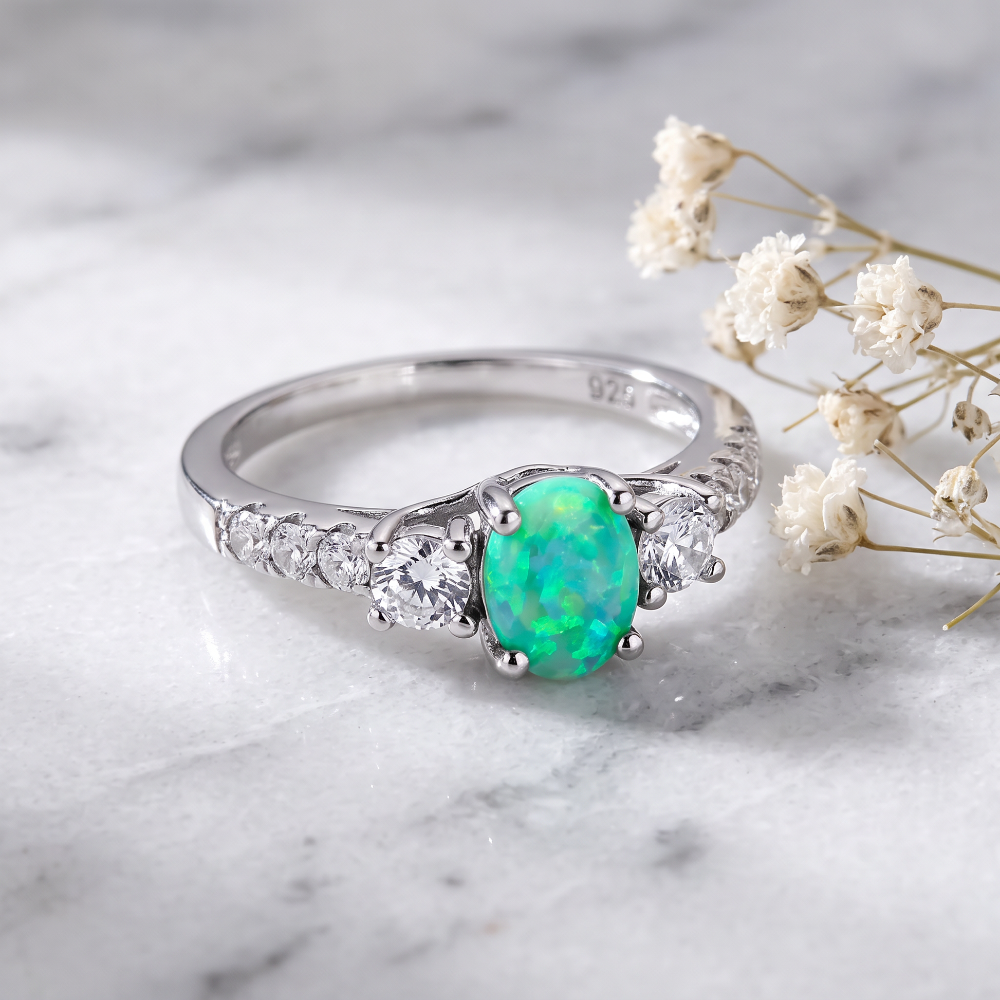 Sterling Silver Enchanted Oval Green Lab Opal CZ Ring on marble