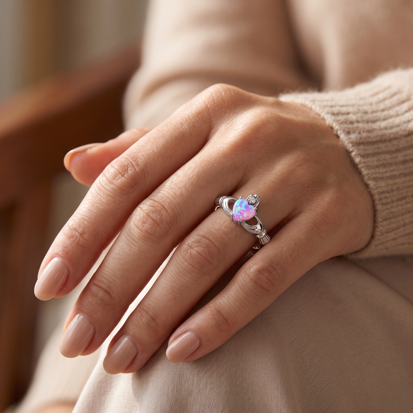 Sterling Silver Claddagh Pink Lab Opal CZ Ring worn on hand