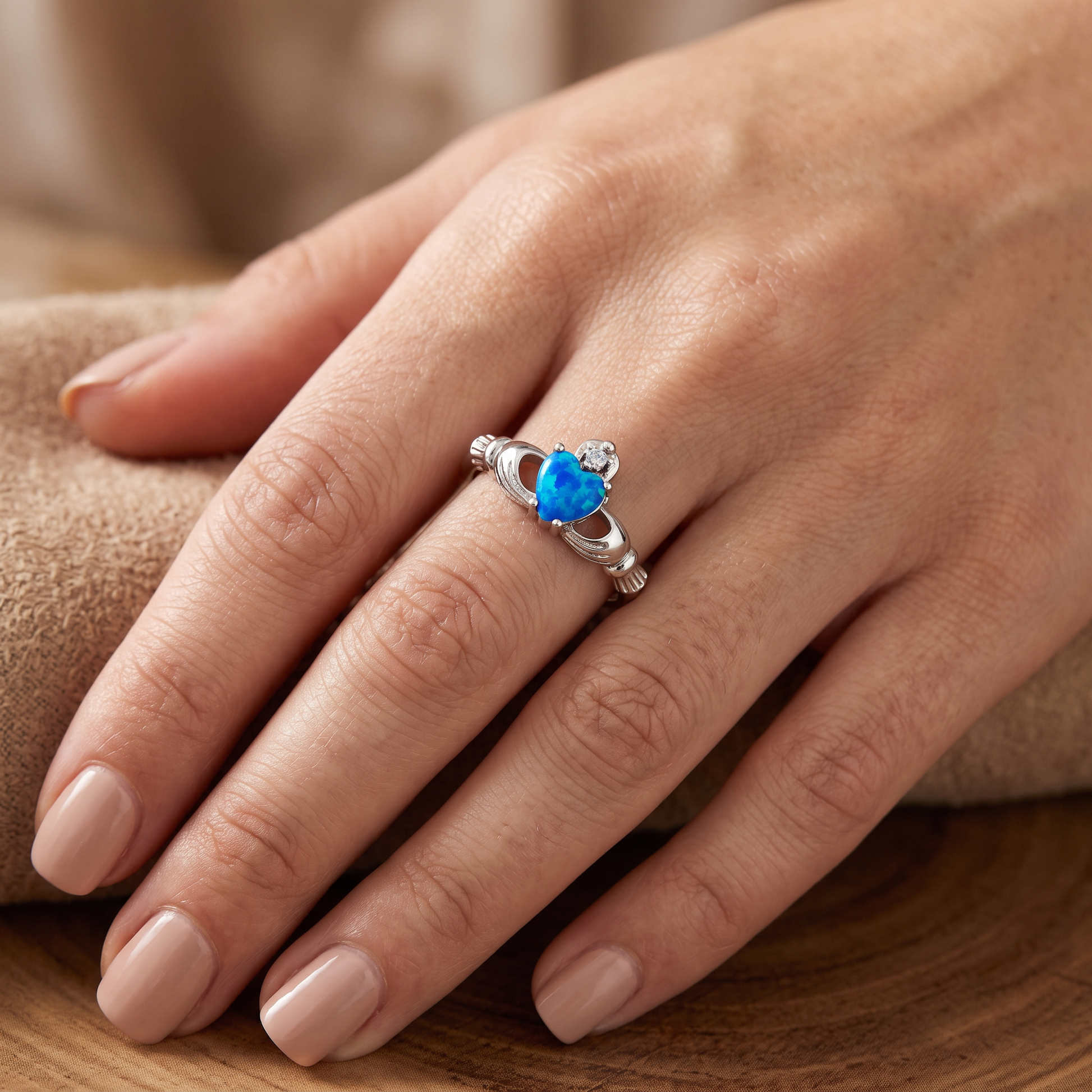 Sterling Silver Claddagh Lab Opal CZ Ring worn on hand
