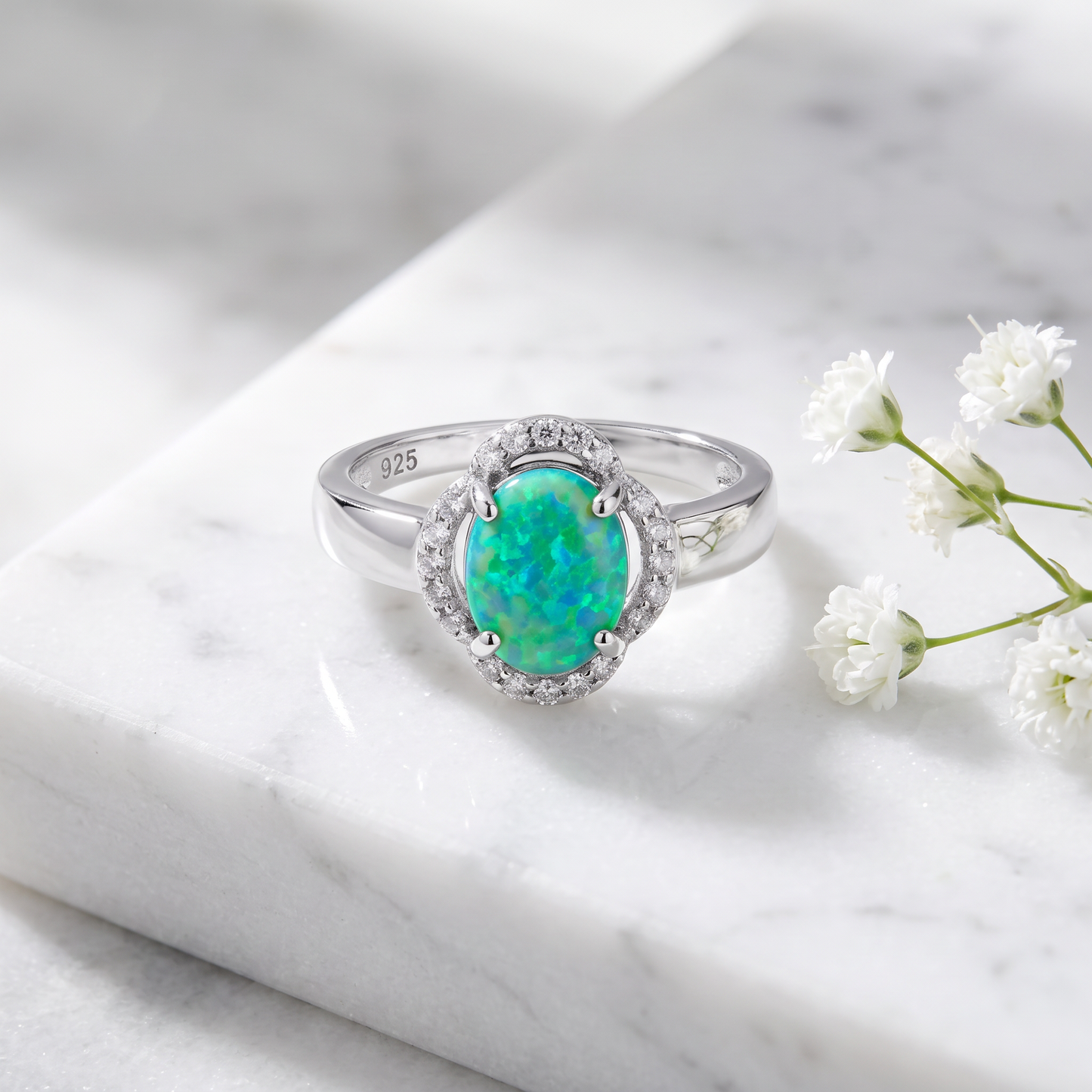 Sterling Silver Green Lab-Opal Oval Halo CZ Ring on marble