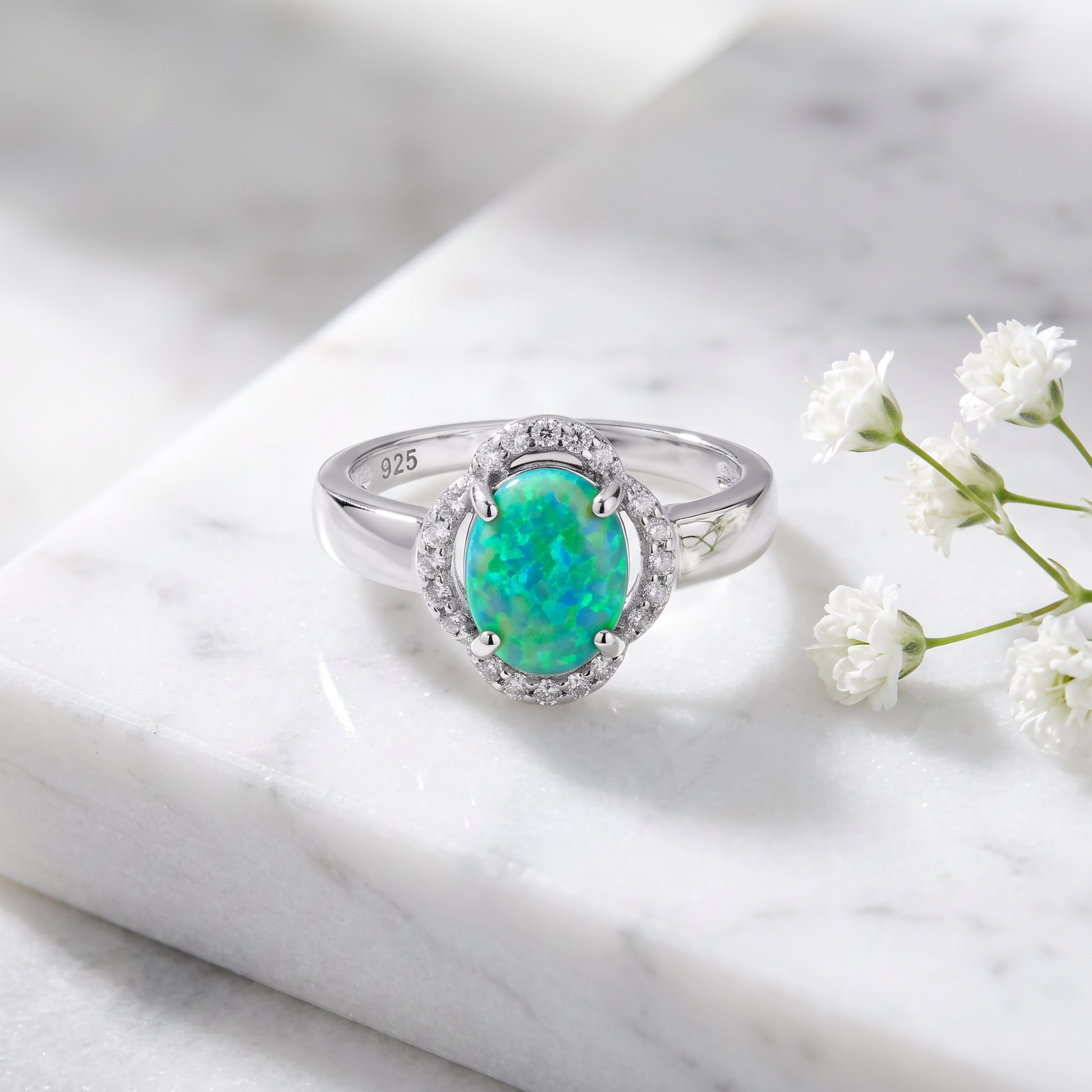 Sterling Silver Green Lab-Opal Oval Halo CZ Ring on marble