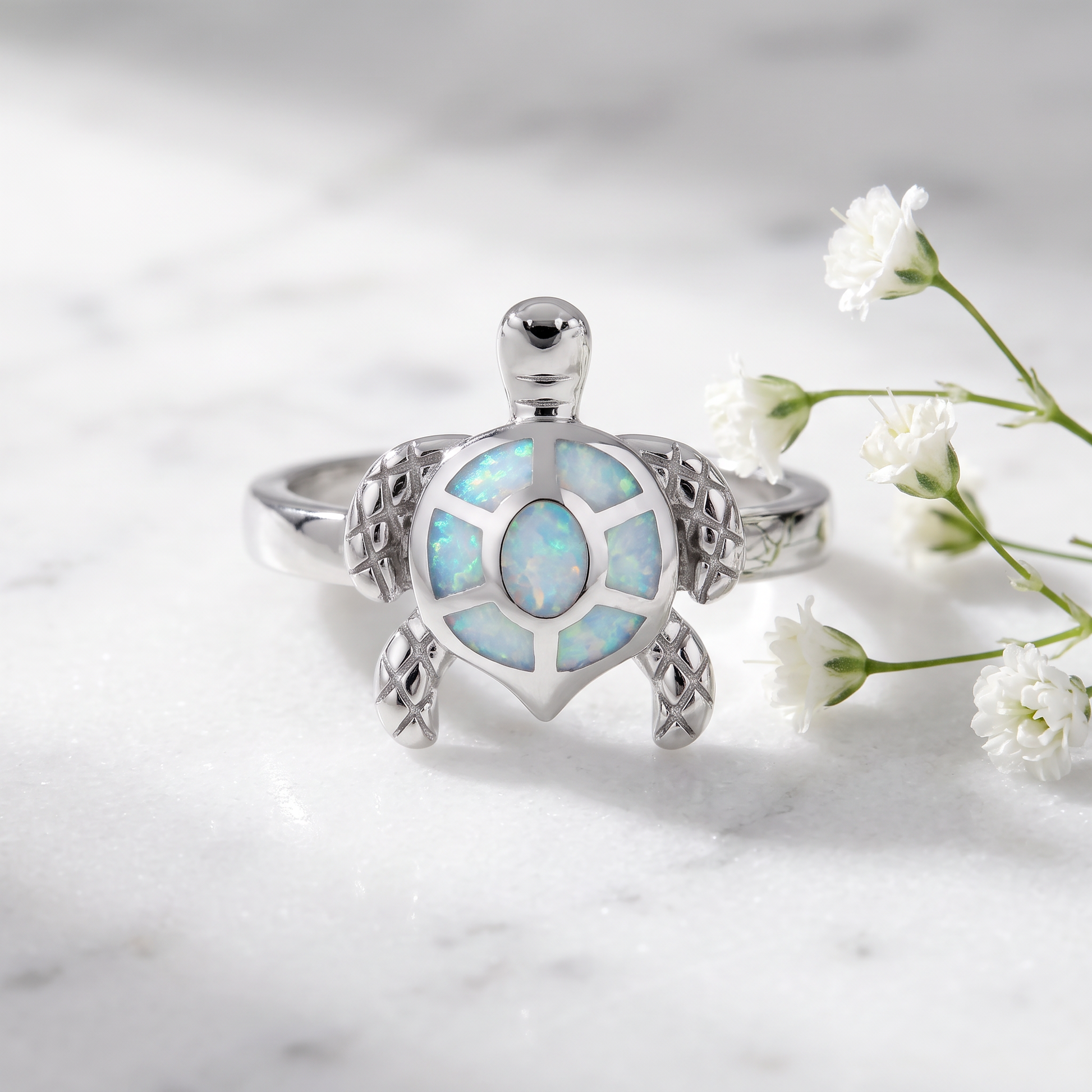 Sterling Silver Turtle White Lab Opal Ring on marble