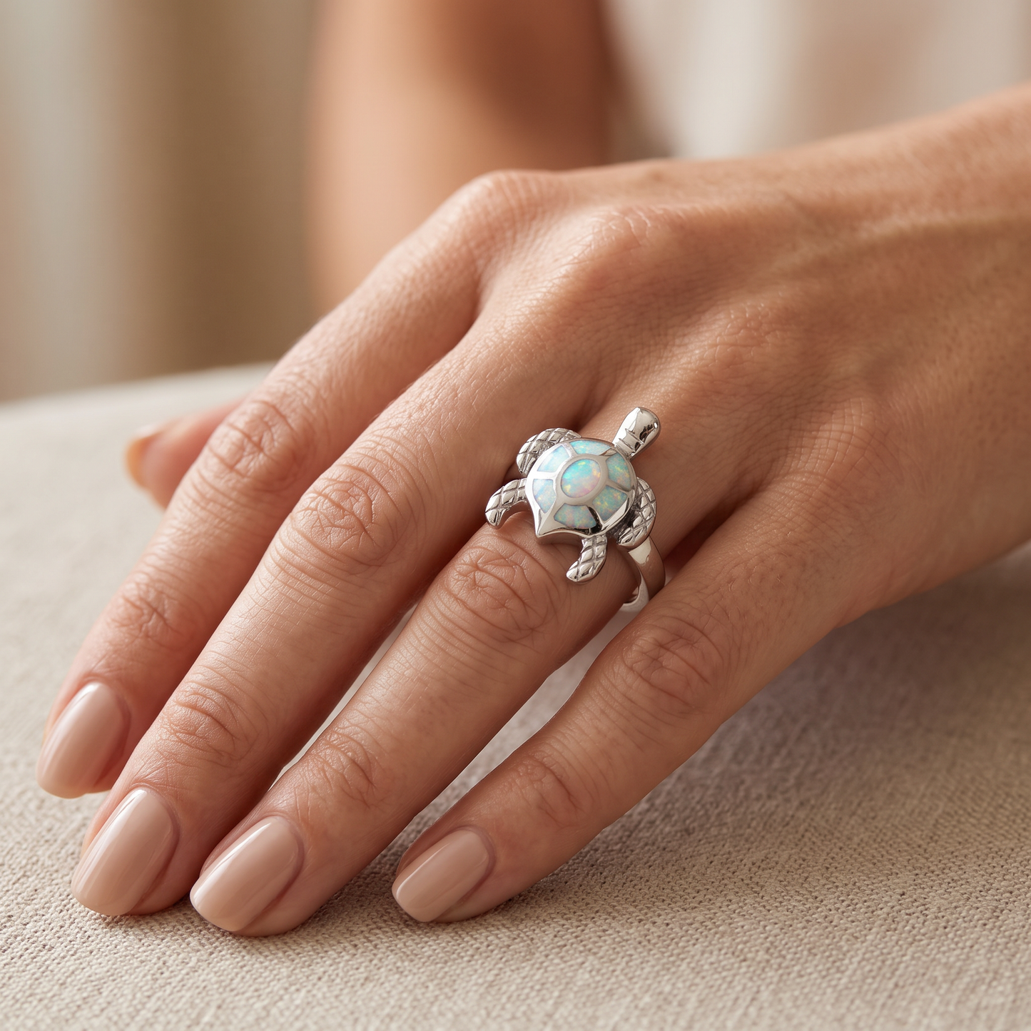 Sterling Silver Turtle White Lab Opal Ring worn on hand